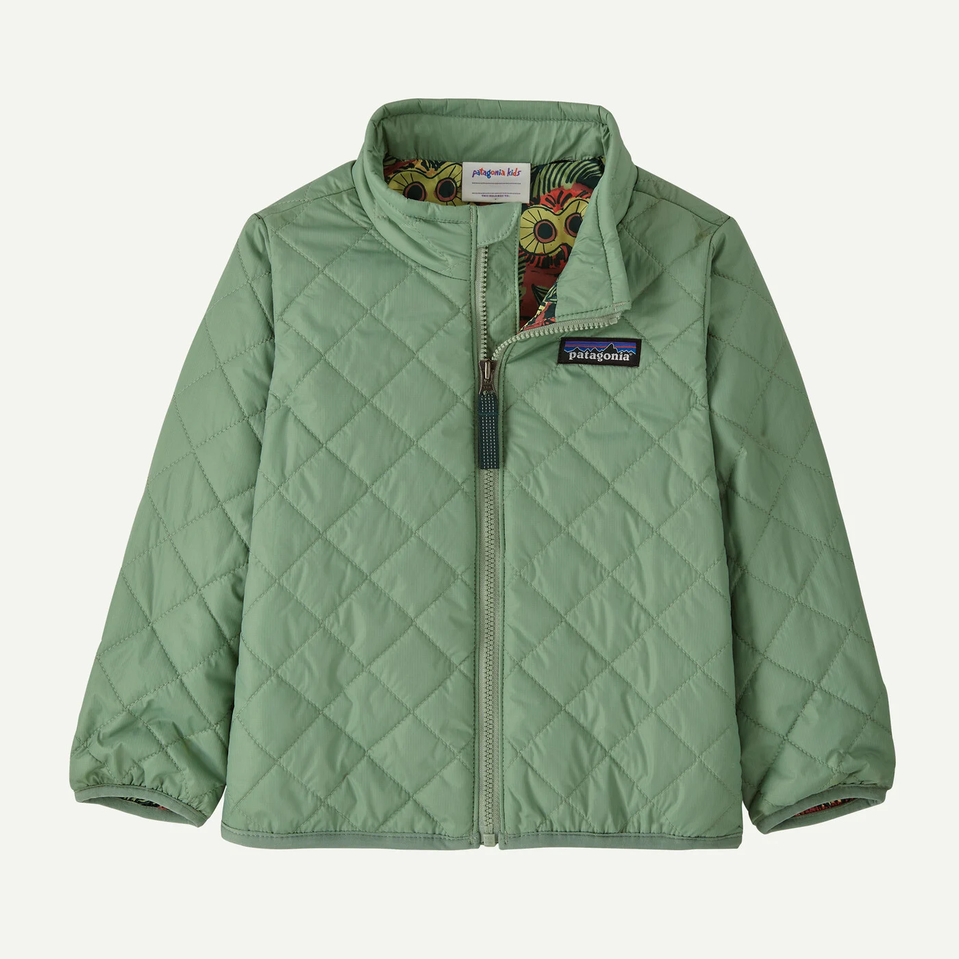 Light green quilted jacket with a stand-up collar and visible zipper. It features a colorful lining and a small logo patch on the chest, conveying a cozy, casual feel.