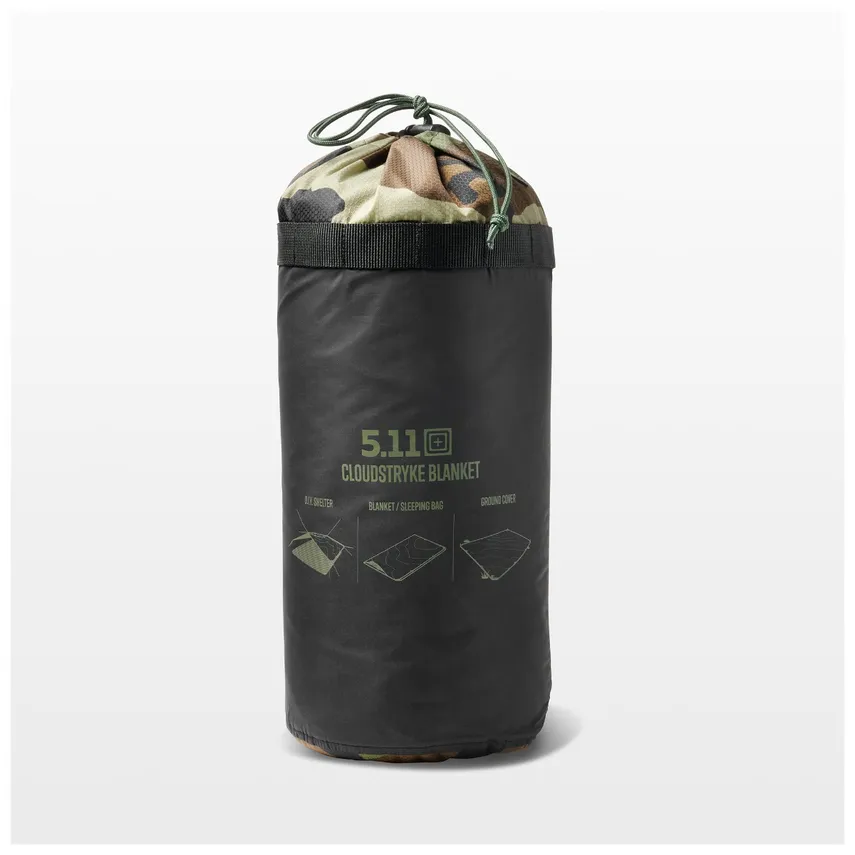 A compact, rolled-up 5.11 Cloudstryke Blanket in a black bag with a drawstring top shows hints of camo fabric. Three icons depict its use: bivy cover, blanket, and ground cover.